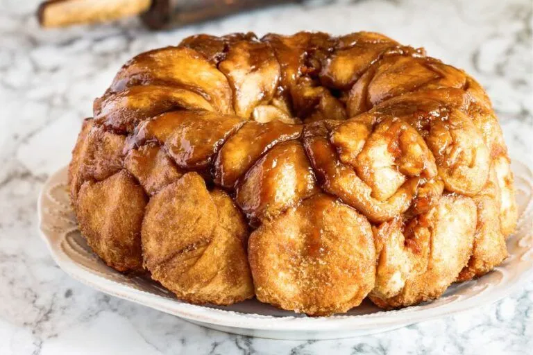 Here’s a delicious Gluten-Free Monkey Bread (Pull-Apart Sweet Bread) recipe that’s soft, gooey, buttery, and perfect for brunch or dessert! 🍞 Gluten-Free Monkey Bread Recipe ✅ Gluten-free | Egg-free optional | Sweet pull-apart treat Ingredients For the Dough: 2 ½ cups gluten-free all-purpose flour (with xanthan gum) 1 tbsp sugar 2 tsp instant yeast ½ tsp salt ¾ cup warm milk (or dairy-free alternative) ¼ cup melted butter (or coconut oil) 1 egg (or 3 tbsp plain yogurt or applesauce for egg-free) For the Coating: ½ cup melted butter ¾ cup brown sugar 1 tbsp cinnamon Optional Glaze: ½ cup powdered sugar 1–2 tbsp milk or cream ¼ tsp vanilla extract Instructions 1. Make the Dough: In a large bowl, whisk together flour, sugar, salt, and yeast. Add warm milk, egg (or substitute), and melted butter. Mix until a soft, sticky dough forms. Cover and let it rise for 45–60 minutes in a warm place (it may not double, but should puff up slightly). 2. Shape and Coat: Grease a bundt or loaf pan. In a small bowl, mix brown sugar and cinnamon. In another, keep melted butter ready. With lightly oiled hands, pinch off small dough balls (~1 tbsp size). Dip each ball in butter, then coat in the cinnamon sugar. Place in pan layer by layer. 3. Second Rise: Cover pan and let dough rest for 20–30 minutes. 4. Bake: Preheat oven to 350°F (175°C). Bake for 28–35 minutes, or until golden and bubbling. Cool for 5–10 minutes, then invert onto a plate. 5. Glaze (Optional): Whisk glaze ingredients together and drizzle over warm monkey bread. 📝 Tips: Use high-quality GF flour (like Cup4Cup, King Arthur, or Bob’s Red Mill 1:1). Don’t skip the cinnamon sugar coating — it’s key for that sticky monkey bread texture. Serve warm for the best gooey pull-apart experience!